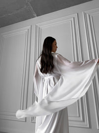 Create a vision of bridal beauty with our Long Silky Robe, featuring sheer chiffon kimono sleeves. Ideal for weddings and bridesmaids, this robe epitomizes sophistication. Okiya Studio