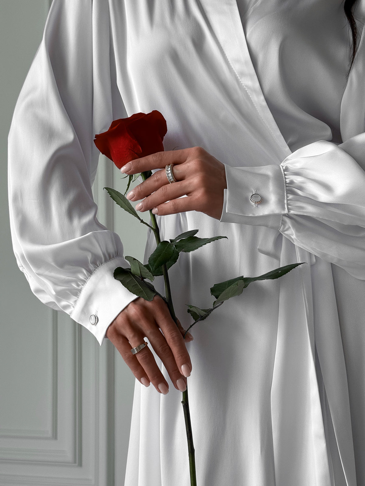 Okiya Studio. Capture the essence of your bridal morning with our Extra Long Robe. The tie waist, open front, and long sleeves with button cuffs ensure a bridal ensemble that exudes both style and comfort.