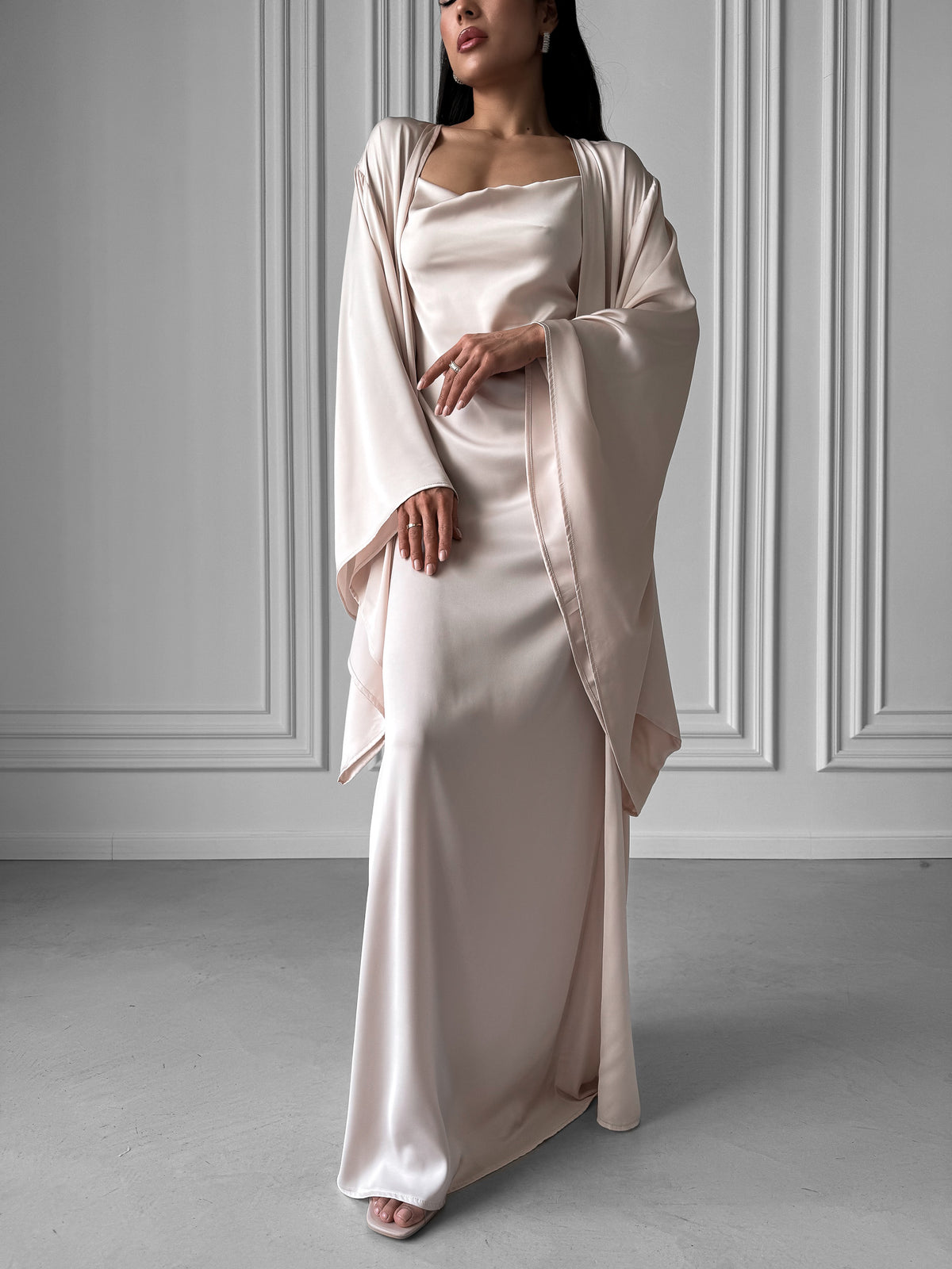 Kimono Robe and Nightgown Set, meticulously designed for those who cherish both elegance and savings. The Kimono Robe, featuring a tie waist, open front, and kimono sleeves, pairs seamlessly with the Nightgown, boasting adjustable straps, A-line design, fitted waist, open back, and floor length. Immerse yourself in the sumptuous embrace of silky fabric and relish the added benefit of special savings when purchasing this exquisite set.