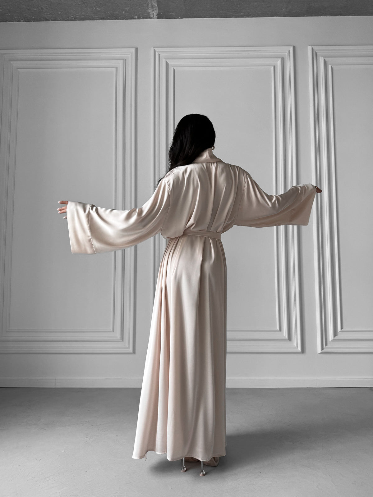 Step into a realm of refined luxury with our Long Silky Robe showcasing a Shawl Collar and enticing side slits. Crafted in sumptuous silky fabric, this robe is designed to elevate your loungewear experience with unparalleled comfort and style. Okiya Studio