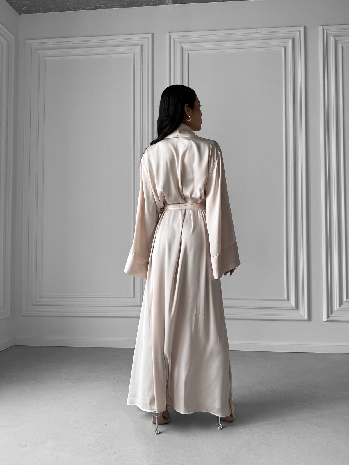 Okiya Studio. Luxury redefined in our Long Silky Robe with Shawl Collar, featuring alluring side slits. Immerse yourself in the opulent embrace of silky fabric, indulging in the perfect balance of comfort and chic sophistication