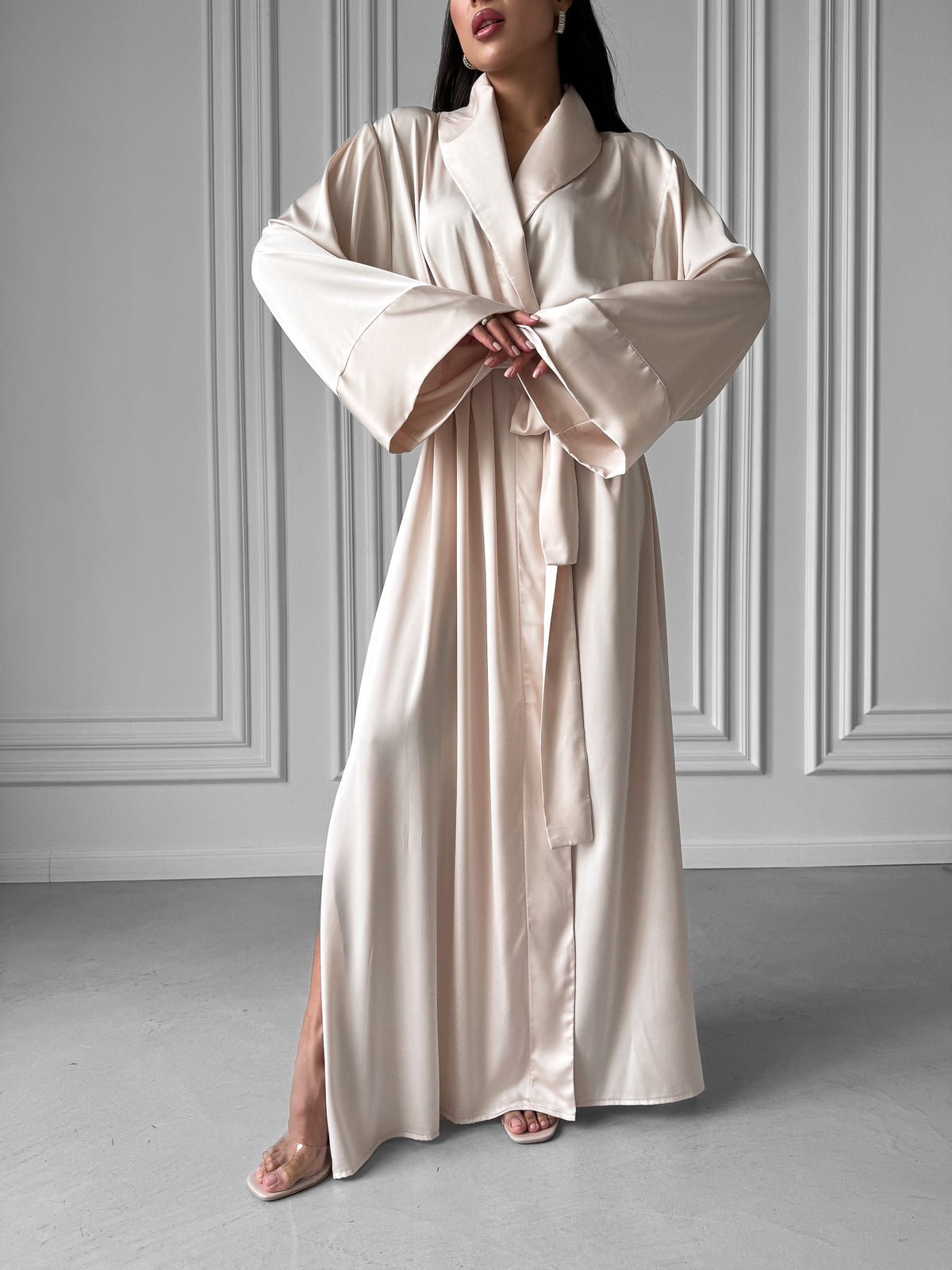 Unwind in style with our Long Silky Robe, adorned with a Shawl Collar and enticing side slits. Crafted from luxurious silky fabric, this robe is the perfect companion for those seeking the perfect blend of comfort and elegance. Okiya Studio