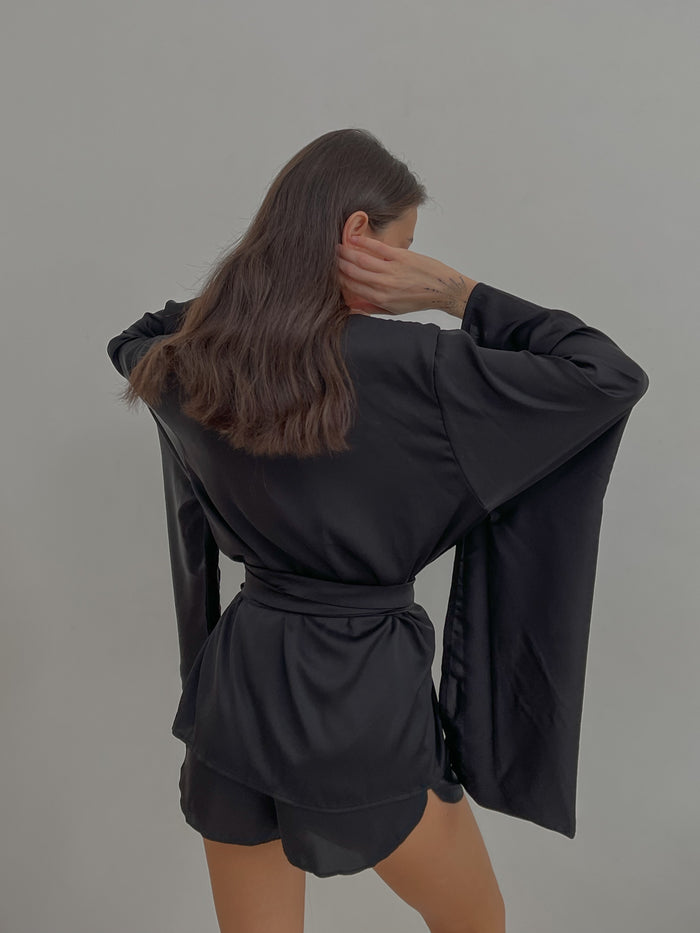 Kimono & Shorts Silky Pajama Set
A close-up of the luxurious silk fabric, highlighting the intricate embroidery on the kimono sleeves and the comfortable shorts. Okiya Studio