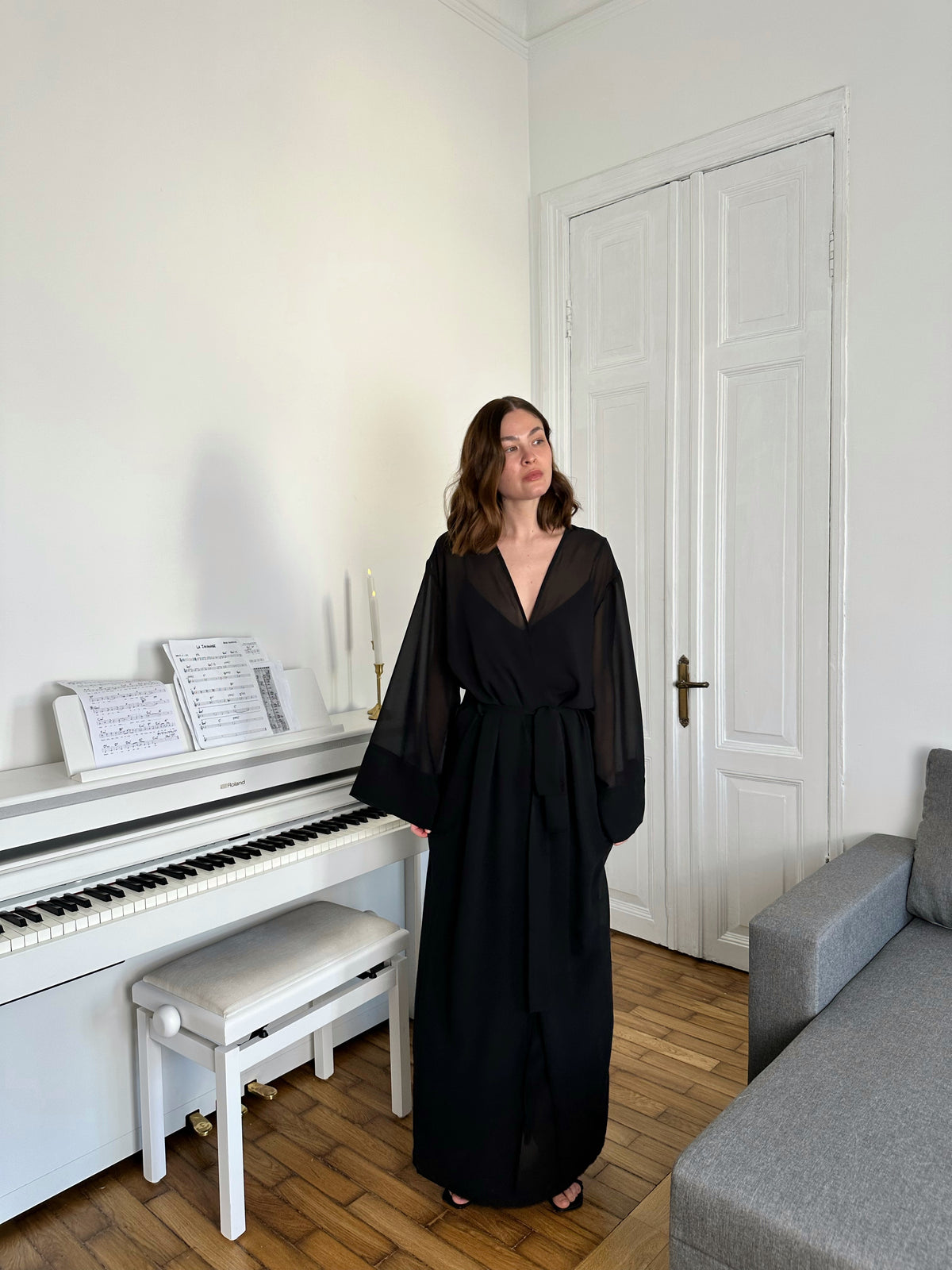 Kiri floor-length sheer chiffon robe in black, with wide flowing sleeves and a self-tie sash — Okiya Studio.