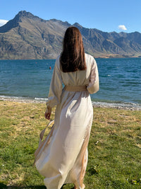 Model walking in the ivory Nami satin robe by the lake — Okiya Studio