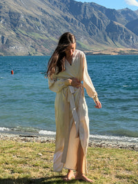 Model walking in the ivory Nami satin robe by the lake — Okiya Studio