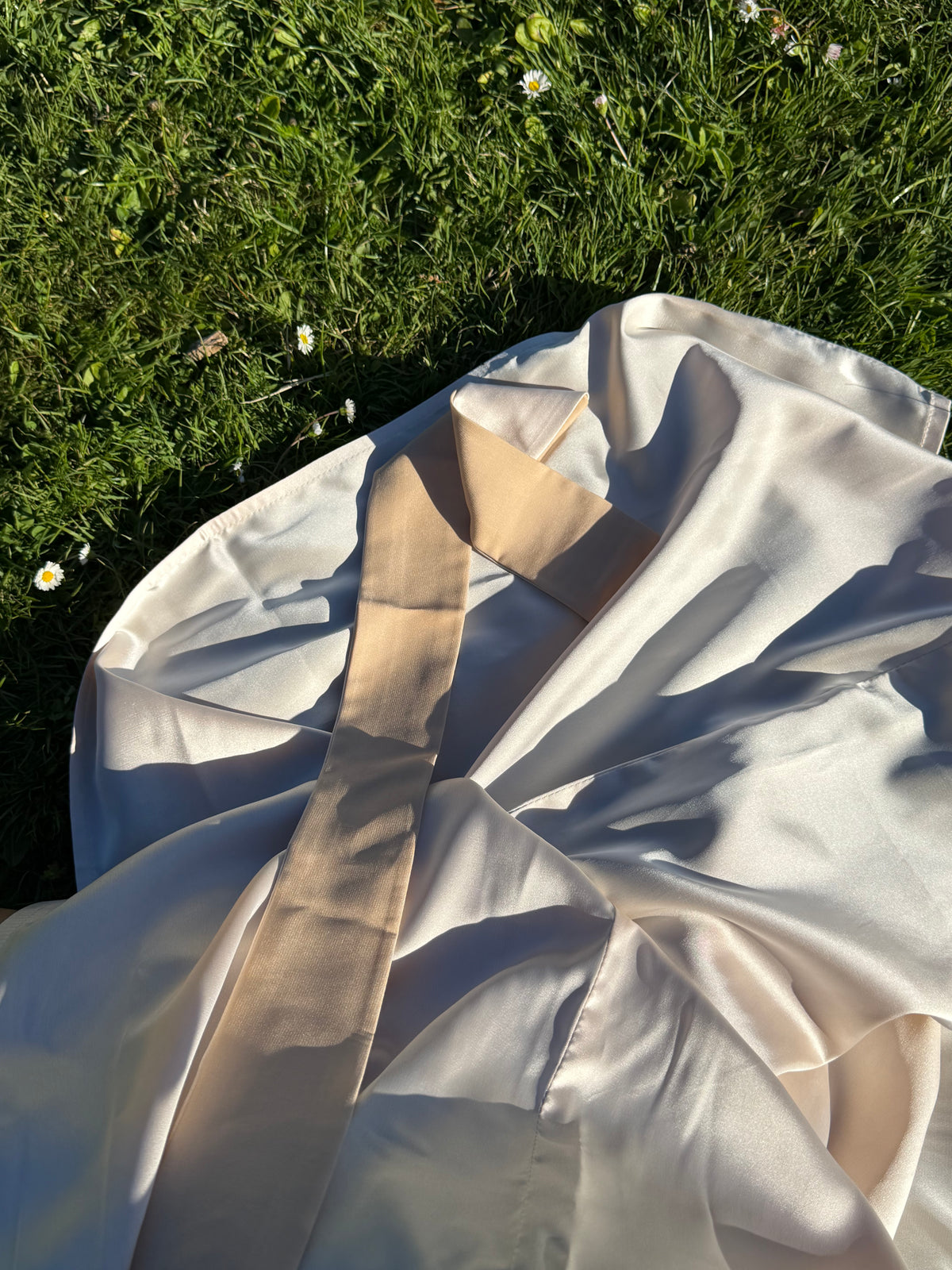 Fluid satin drape and floor-length hem of the Nami robe — Okiya Studio