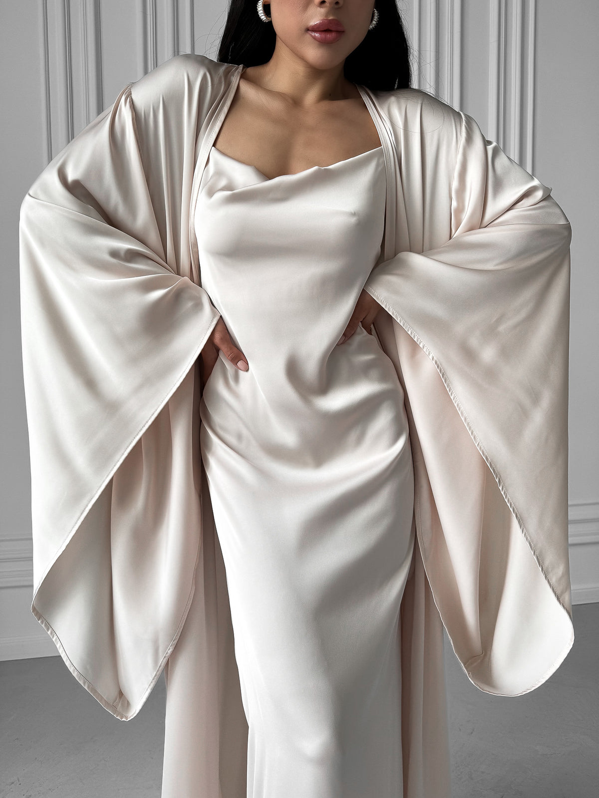 Discover the epitome of affordable luxury with our Kimono Robe and Nightgown Set. This sumptuous ensemble includes a Kimono Robe featuring a tie waist, open front, and kimono sleeves, and a Nightgown with adjustable straps, A-line design, fitted waist, open back, and floor length. Crafted in silky fabric, this set is an ideal choice for bridal robes, wedding mornings, and those who seek the perfect balance of sophistication and savings