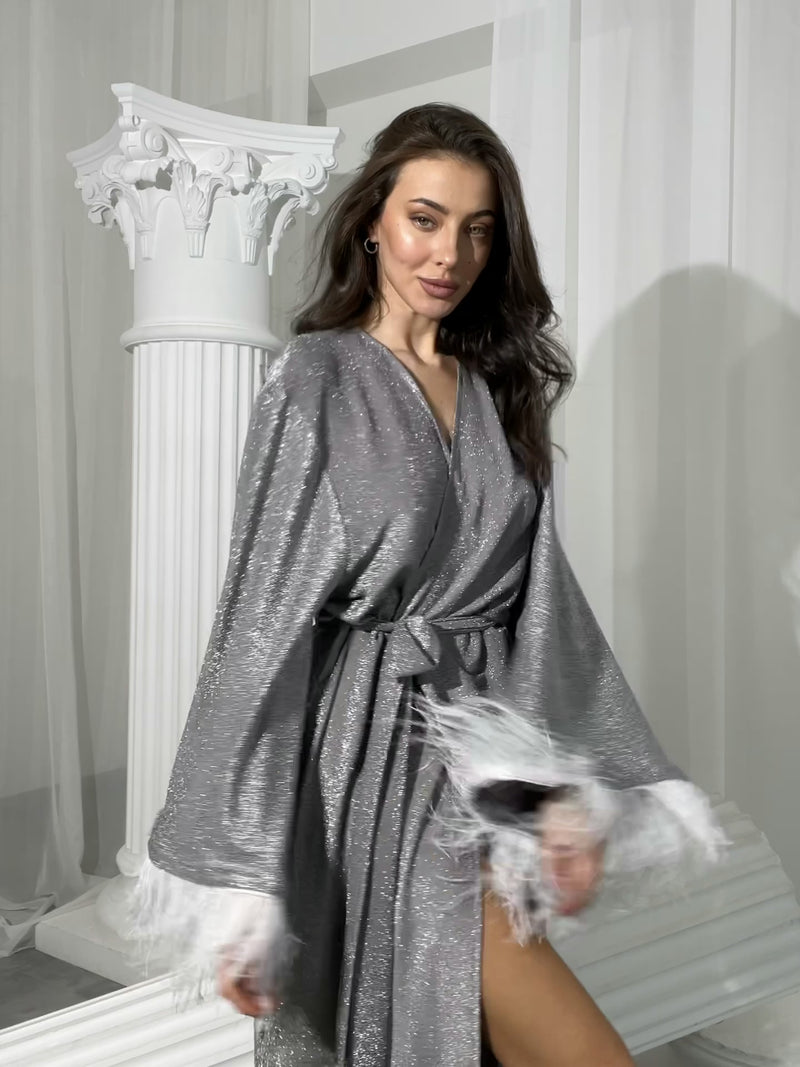 Shiny silver robe with feathers sleeves